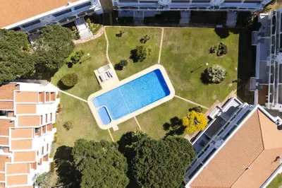 an empty room with white walls and white columns at Pinhal do Golfe - 2 Bedrooms - Vilamoura in Vilamoura