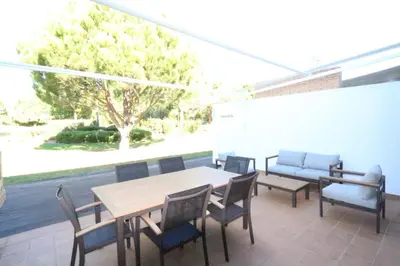 a patio with a table and chairs and a couch at Villa Dolce Vita CD 81 - Clever Details in Vilamoura