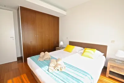 a bedroom with a bed with towels on it at Villa Dolce Vita CD 81 - Clever Details in Vilamoura