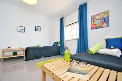 a living room with a couch and a table at Apartment Ipanema 3 by Algarve Vacation in Albufeira