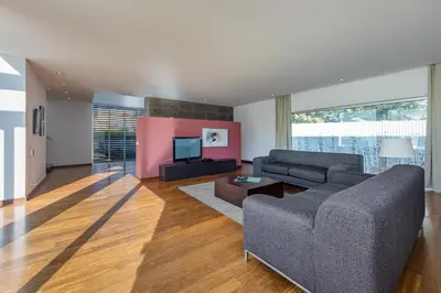 a living room with a couch and a tv at Villa Ocean Pine in Albufeira