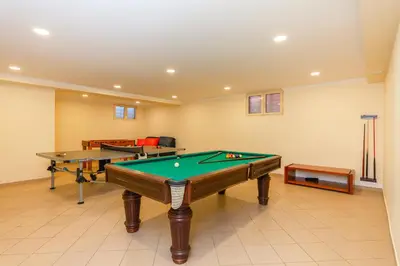 a billiard room with two ping pong tables at Villa California by Algarve Vacation in Albufeira