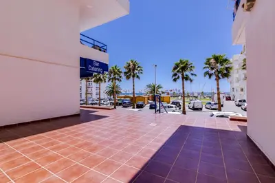 a view of a parking lot with palm trees at Mar apartment wonderful view - Quarteira in Quarteira