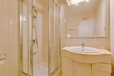 a bathroom with a sink and a shower at Mar apartment wonderful view - Quarteira in Quarteira