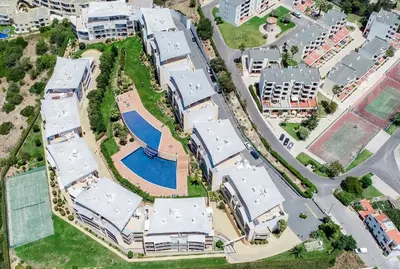 an aerial view of a marina with a bunch of boats at BnB Homes Ocean view Apartment with 3 spacious Terraces, 2 Swimming pools & Tennis court in Albufeira