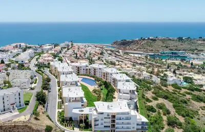 a view of a golf course with trees at BnB Homes Ocean view Apartment with 3 spacious Terraces, 2 Swimming pools & Tennis court in Albufeira