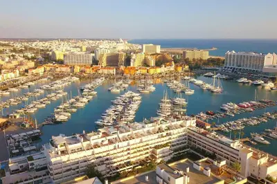 an aerial view of a marina with boats in the water at Modern Top Floor Apartment 60m2 - Balcony with Pool & Sea View - Vilamoura in Vilamoura
