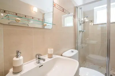 a bathroom with a sink and a toilet at Casa Laranja Three bedroom Villa in Loulé