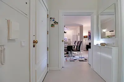 a hallway with a white door and a dining room at Vilamoura Design 1 with Pool by Homing in Vilamoura