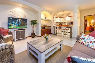 a living room with a couch and a coffee table at Clementina Duplex apartment in Albufeira