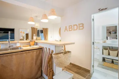 a kitchen with a sink and a counter top at Baixa de Faro Rooftop in Faro