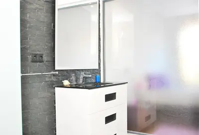 a bathroom with a white sink and a shower at Villa Waikiki by Algarve Vacation in Albufeira