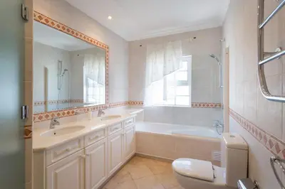a bathroom with a tub and a sink and a toilet at Aleisha in Vale do Lobo
