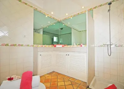 a bathroom with a shower and a large mirror at Villa Bogota by Algarve Vacation in Albufeira