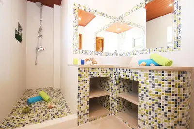 a bathroom with a sink and a mirror at Villa Moorea by Algarve Vacation in Guia