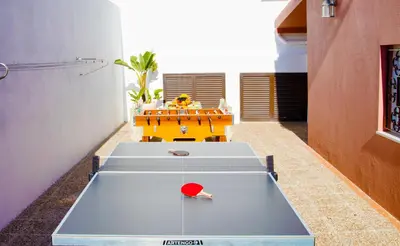 a group of tables in a room with a table at Villa Saint Martin by Algarve Vacation in Albufeira