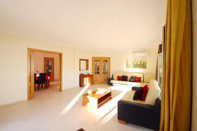 a living room with a couch and a table at Villa Pauline by Algarve Vacation in Albufeira