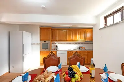 a kitchen with a table with fruit on it at Villa Morais by Algarve Vacation in Guia