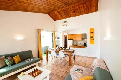 a living room with a couch and a table at Villa Krabi by Algarve Vacation in Albufeira
