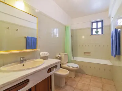 a bathroom with a sink and a toilet and a mirror at Villa Flor de Maio by Interhome in Patroves