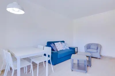 a balcony with a table and a view of the city at Tália - City Center - Vilamoura in Vilamoura