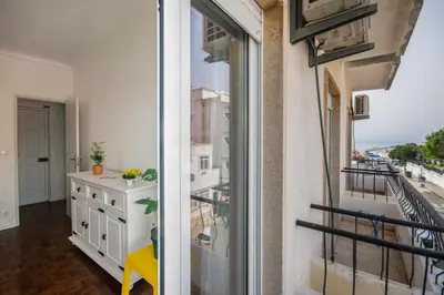 a apartment with a balcony with a view of the city at T2 Apartamento do Tenis in Albufeira