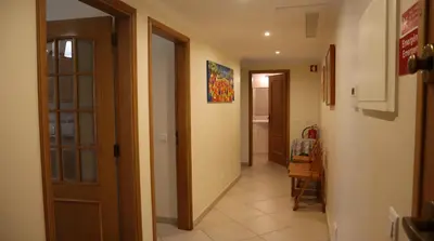 a hallway with a hallway leading to a room at Casablanca By Albufeira Rental in Albufeira