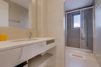 a bathroom with a sink and a shower at Cruzeiro do Sul Apartments - Vilamoura center in Vilamoura