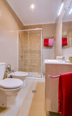 a bathroom with a toilet and a sink and a shower at York - Sea view - Quarteira in Quarteira