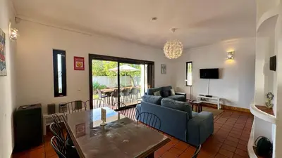 a living room with a couch and a table at El Gharbe by Check-in Portugal in Albufeira