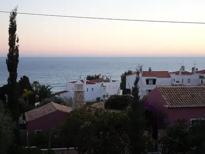 a view of a town with the ocean in the background at El Gharbe by Check-in Portugal in Albufeira