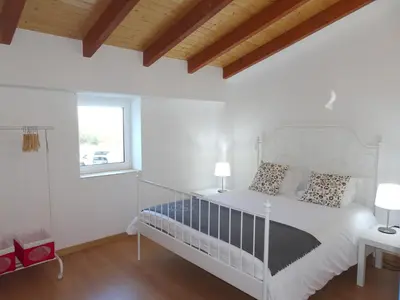 a white bedroom with a white bed and a window at Gold by Check-in Portugal in Albufeira