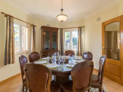 a dining room with a table and chairs at Casa Campo Spacious Living Private Pool Tranquil Setting in Guia