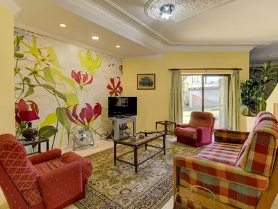 a living room with two couches and a tv at Casa Vilamoura in Vilamoura