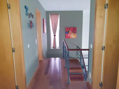 a hallway with a blue staircase and a window at Luxury Villa Corcovada Nicole with privat heated pool in Albufeira