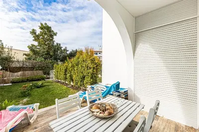 a porch with a table with a basket of mushrooms at Edif. Valemangude in Albufeira