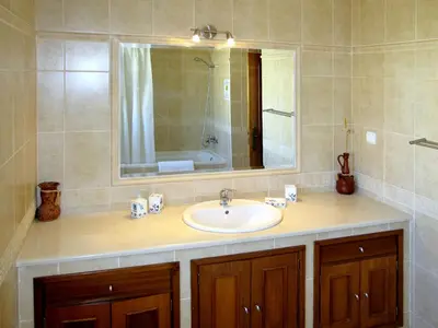a bathroom with a sink and a mirror at Holiday Home Vila Sol by Interhome in Cabeço de Câmara