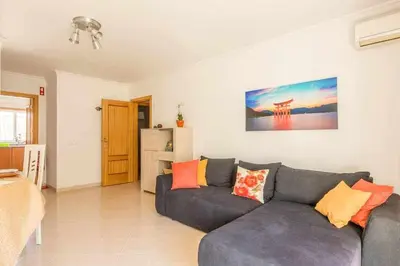 a living room with a couch and a table at Albufeira Old Town Two bedroom Apartment Center in Albufeira