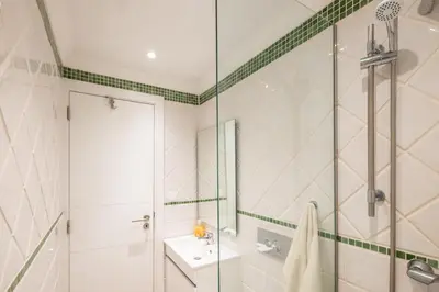a bathroom with a shower and a sink at #017 T2 Rossio by Home Holidays in Albufeira