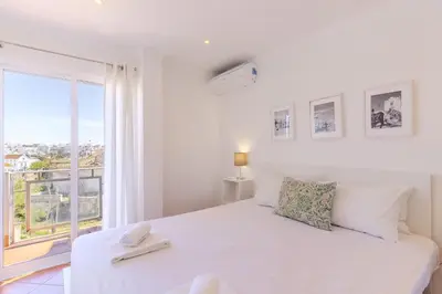 a view of the beach and buildings at #008 T2 Tenis by Home Holidays in Albufeira