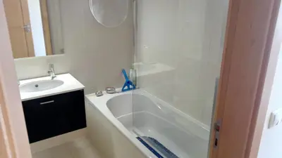 a bathroom with a tub and a sink and a shower at Monte da Eira apartments in Albufeira