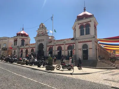 a large building with motorcycles parked in front of it at Bicas Velhas Studio in Loulé
