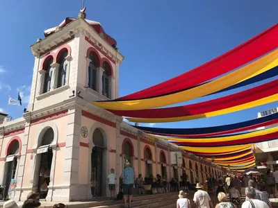 a large colorful canopy over a building with a tower at Bicas Velhas Studio in Loulé