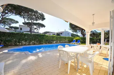 a bathroom with two sinks and a tub and a toilet at Charming Villa, Private Pool, Walking Distance to Centre, Free AC Wifi in Quarteira