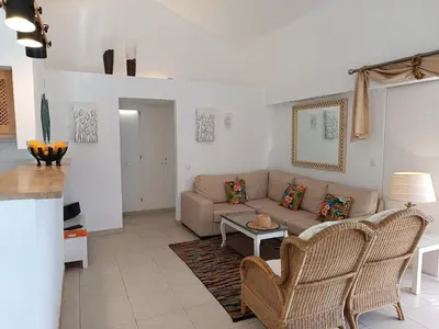 a living room with a couch and a table at Villa 81 great spot Oura beach, Albufeira in Albufeira