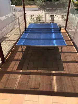 two blue ping pong tables sitting on a deck at Villa Adrian & Brian in Albufeira