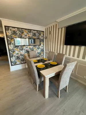 a dining room with a table and chairs at Villa Quévin in Albufeira