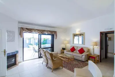 a living room with a couch and a table at Villa 2, great spot Oura beach, Albufeira in Albufeira