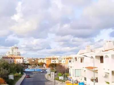 a view of a street in a city with buildings at Areias Apartment by Stay ici Algarve Holiday Rental in Albufeira