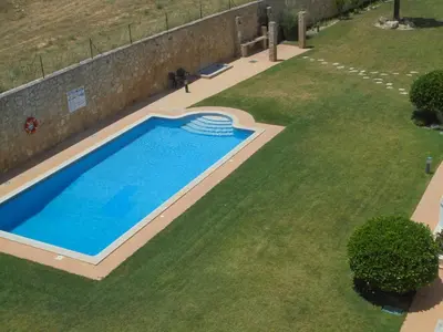 an overhead view of a swimming pool in a yard at Jardim Paraiso Apartments in Albufeira